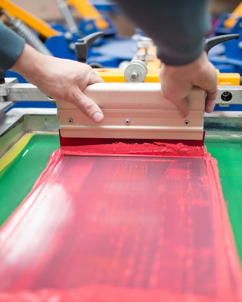 Screen printed bold logo on custom team apparel