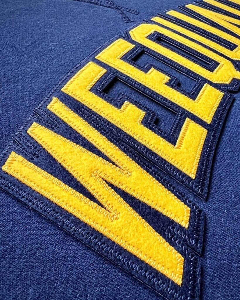 Tackle twill layered stitched letters and numbers on a jersey